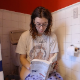 A Canadian girl with dark hair and wearing glasses takes a soft-sounding shit and a piss while sitting on a toilet reading a book. She sings, shows us her product, then wipes her ass. Presented in 720P HD. About 7 minutes.